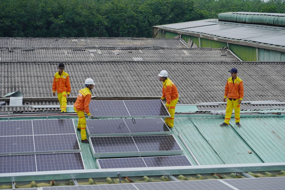 Solar installation professionals working on a residential roof